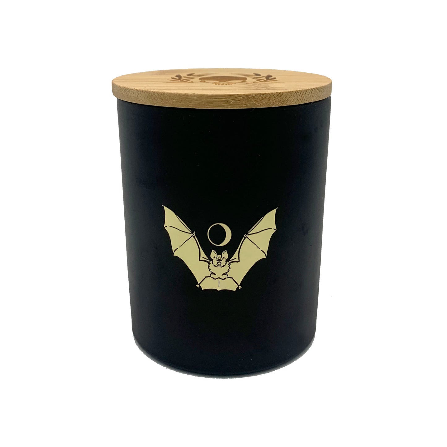 soy wax candle with matte black base and gold foil design of bat and crescent moon. T'erre de hermes scent.