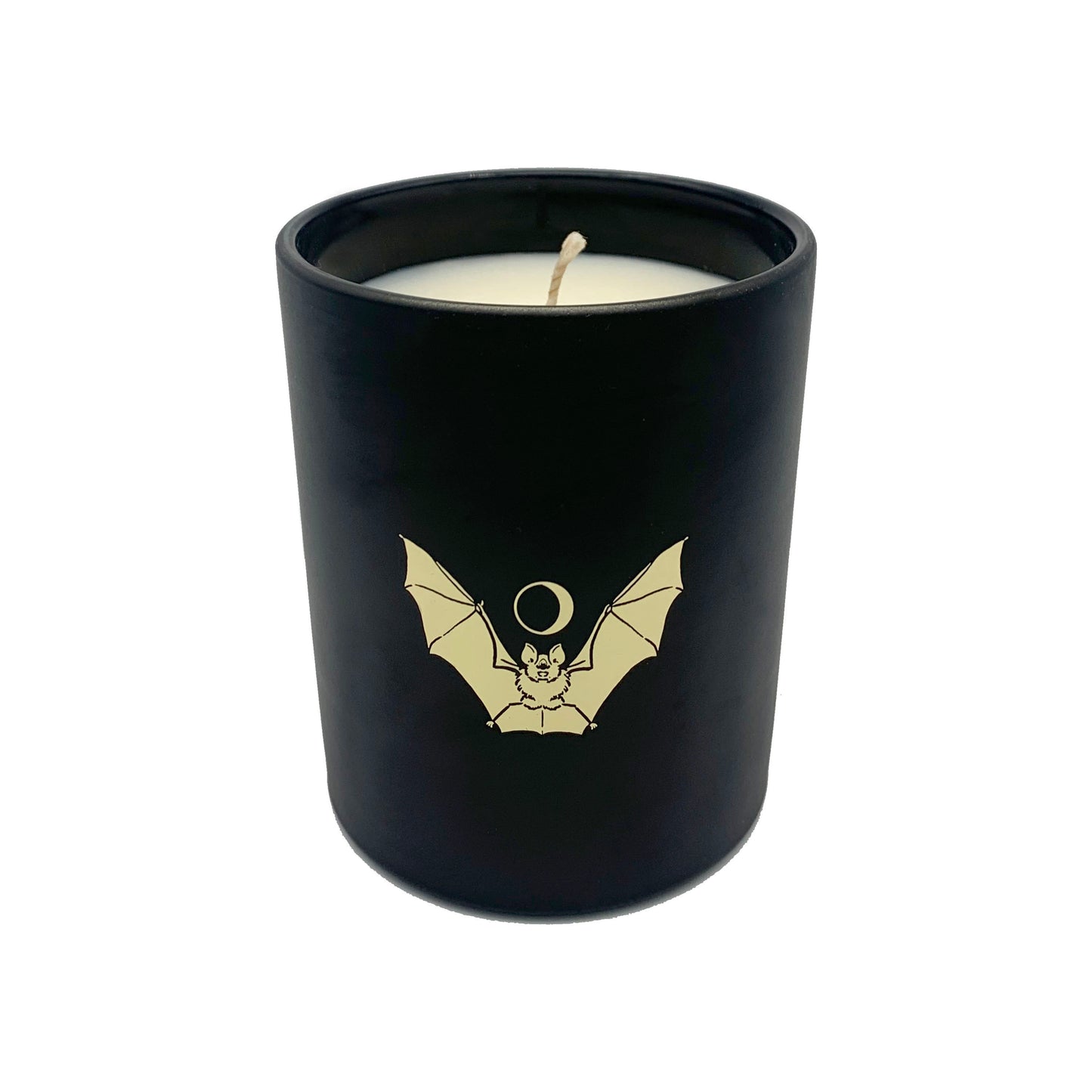 soy wax candle with matte black base and gold foil design of bat and crescent moon. T'erre de hermes scent.