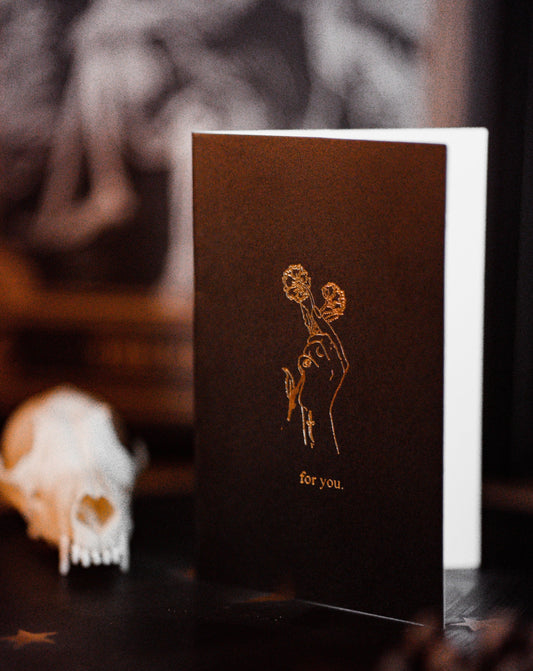 greeting card made of black paper and gold foil printed design by Amrit Brar and 13th Press. Blank inside