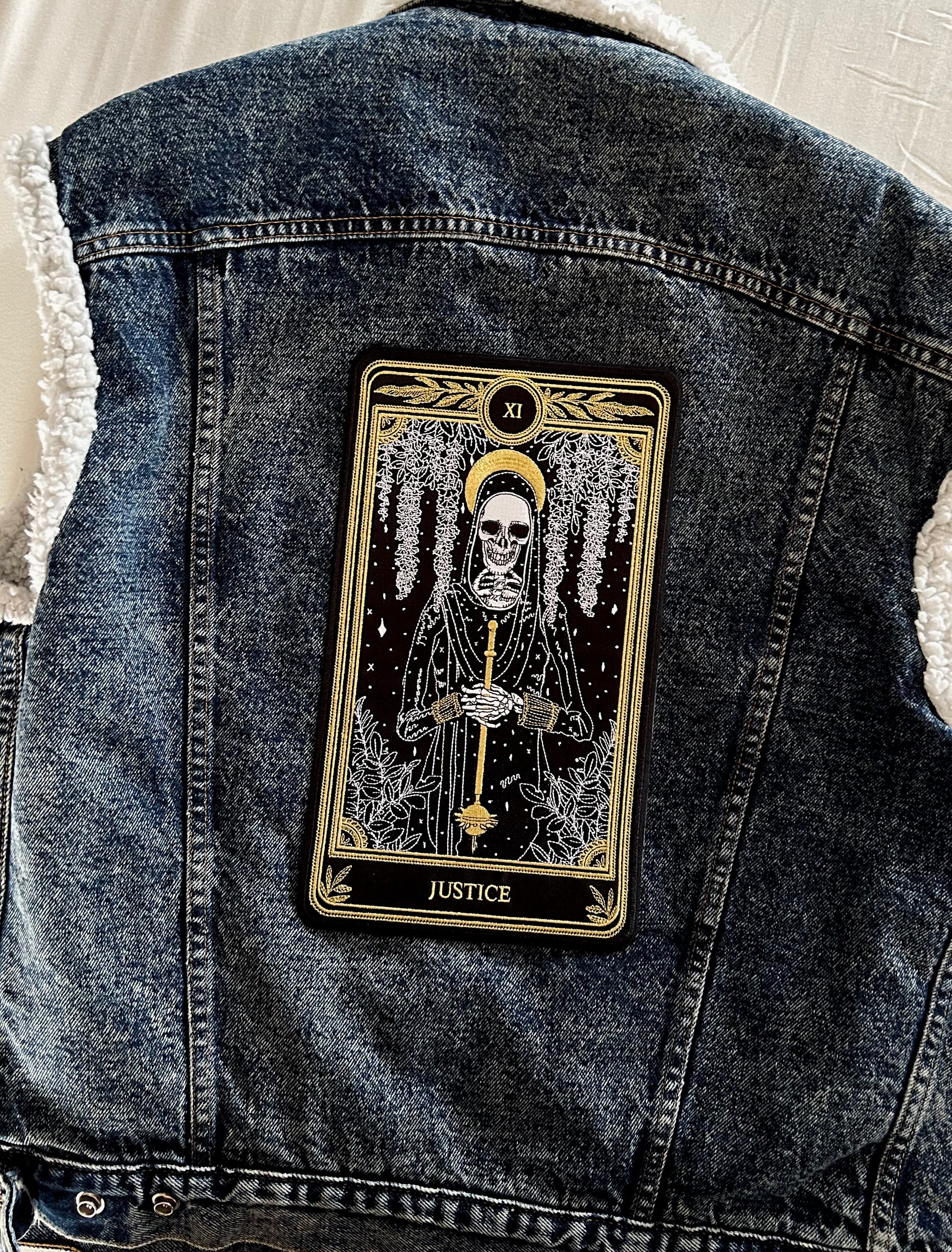 large embroidered iron-on back patch with justice tarot card design from the marigold tarot deck