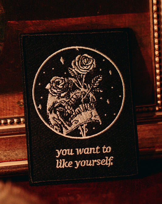 black and white embroidered iron-on patch with skull and rose design by Amrit Brar and 13th Press