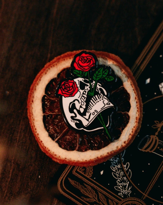 metal hard enamel pin of skull head and red roses designed by Amrit Brar and 13th Press