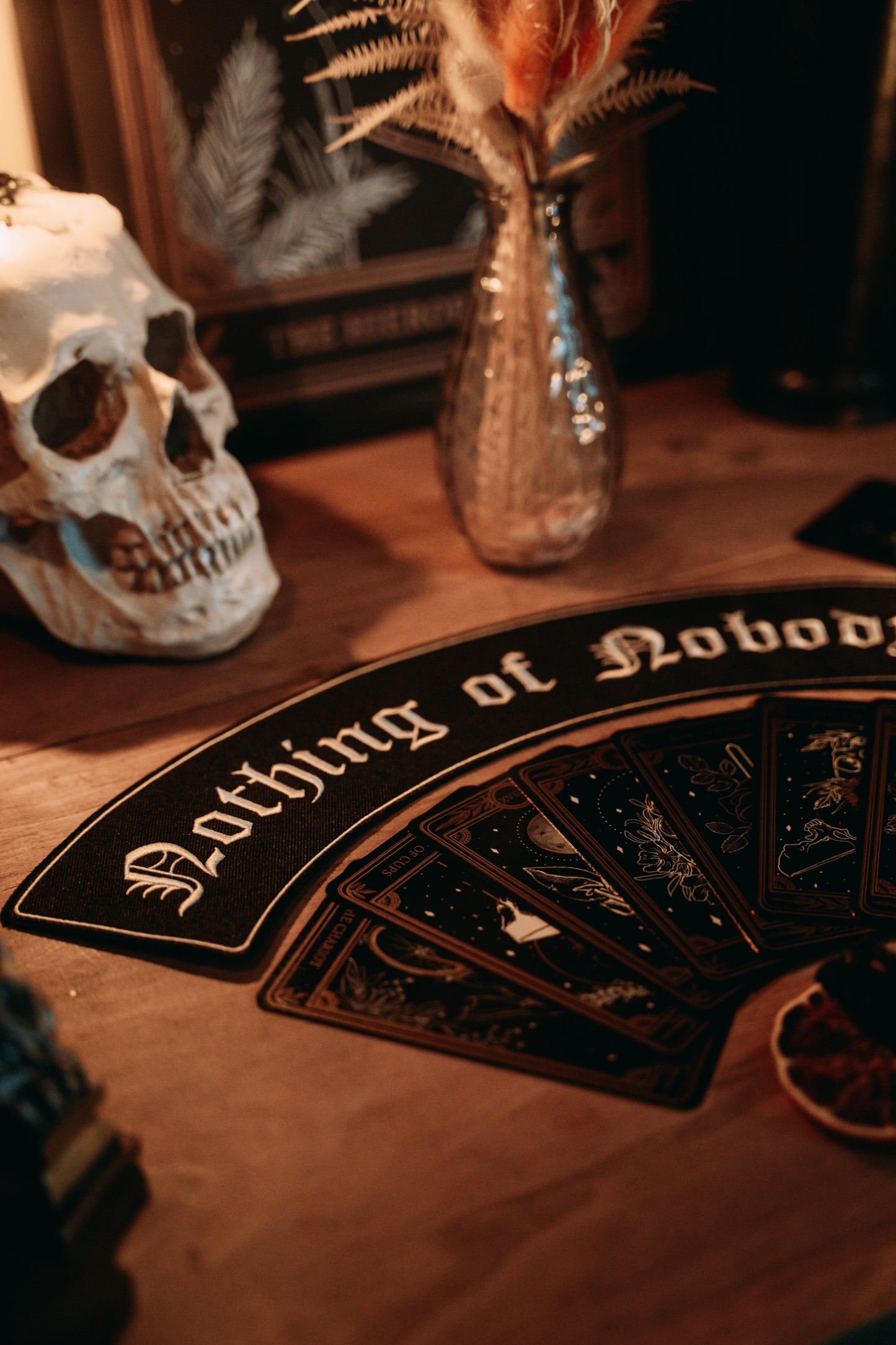 black and white embroidered large iron-on patch that reads "nothing of nobody's" in gothic font.