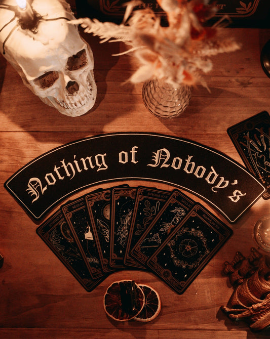 black and white embroidered large iron-on patch that reads "nothing of nobody's" in gothic font.