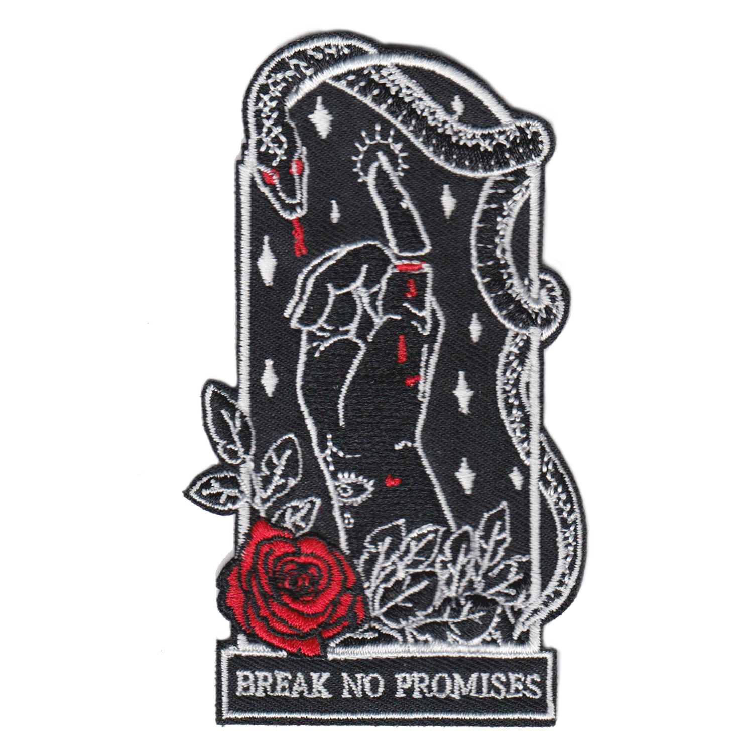 2.5"Wx4"H coffin-shaped embroidered patch featuring an iron-on backing. Patch reads "break no promises." We recommend that you apply a few stitches so the corners do not lift. Designed by Amrit Brar, produced by 13th Press. Embroidered patch, iron-on patch, denim patch, leather patch, biker patch, punk patch