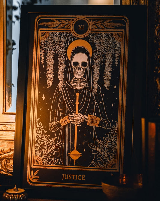tarot art print with Justice card design from the Marigold Tarot deck by Amrit Brar and 13th Press. Black and gold ink.