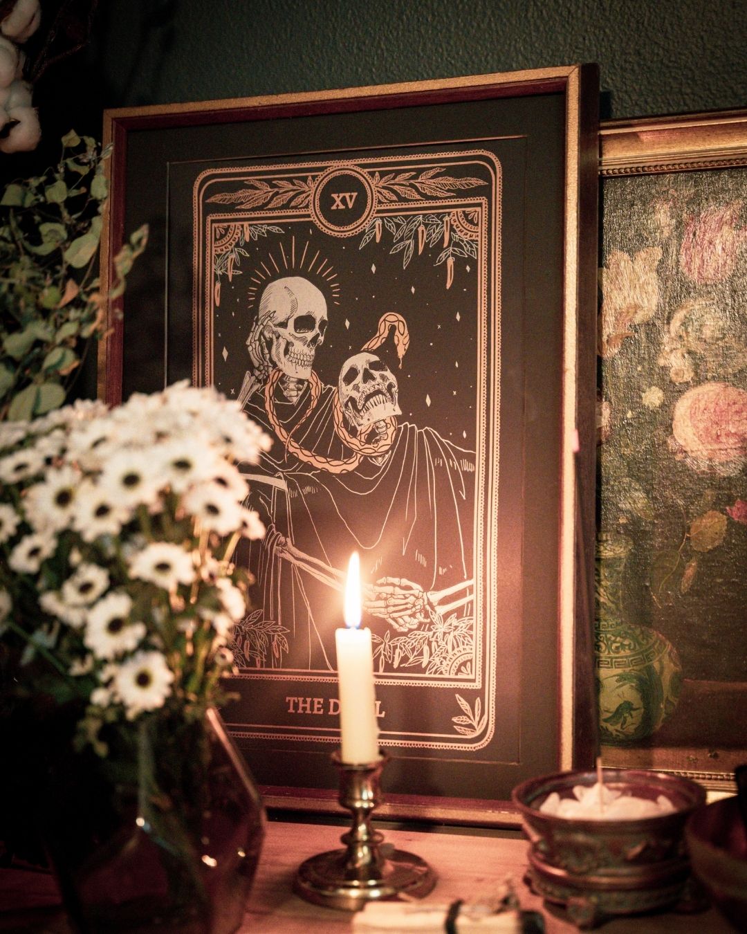 Tarot Devil print from the Marigold Tarot deck by Amrit Brar and 13th Press. With skull and candle decor on altar. Skeleton and serpent. Gold ink