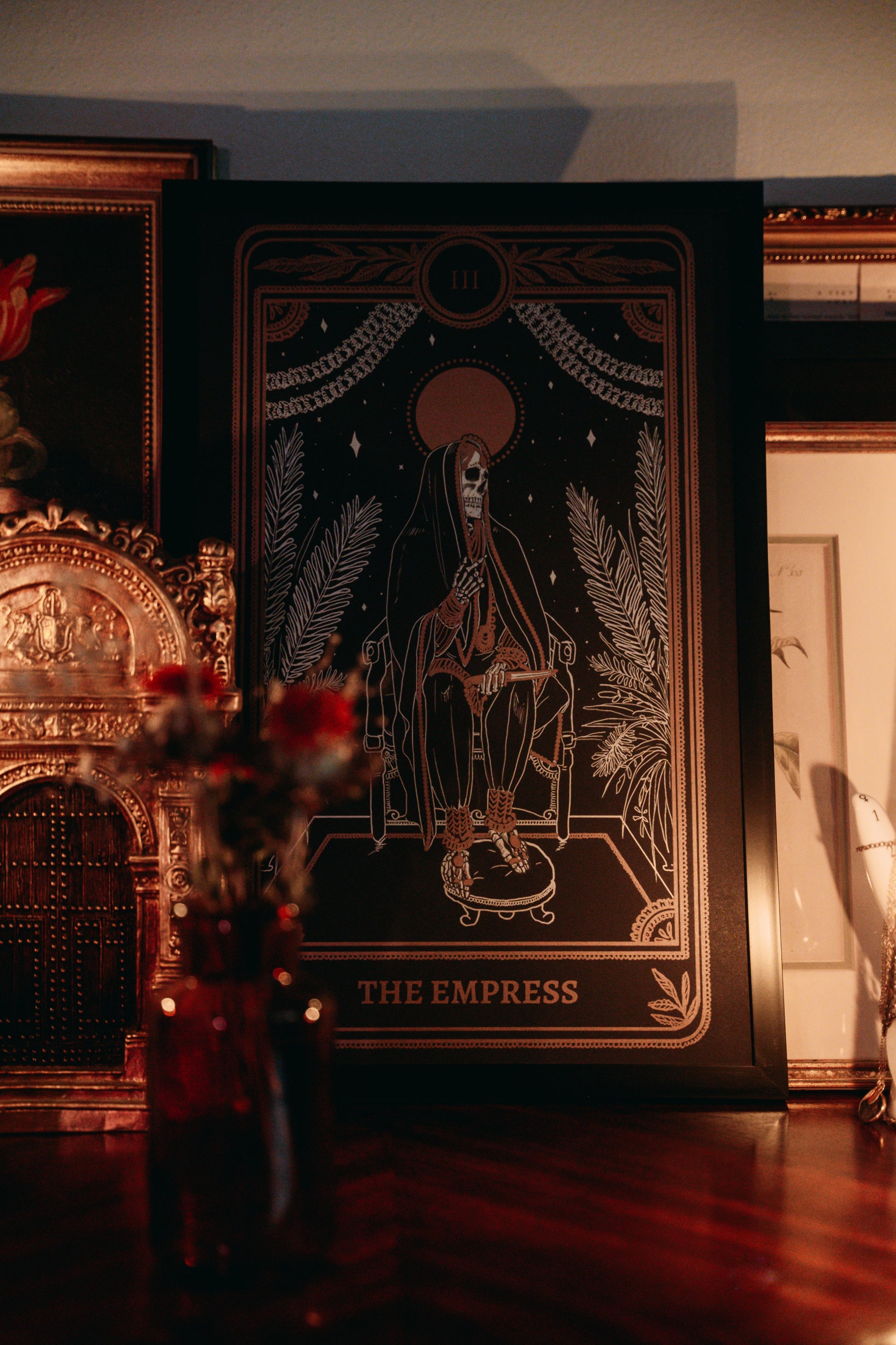 tarot wall art of the Empress card from the Marigold Tarot deck by Amrit Brar and 13th Press on altar with candle light and tarot card reading