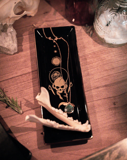 ceramic trinket tray with gold design of skull and serpant for small trinkets, tarot inspired black tray.