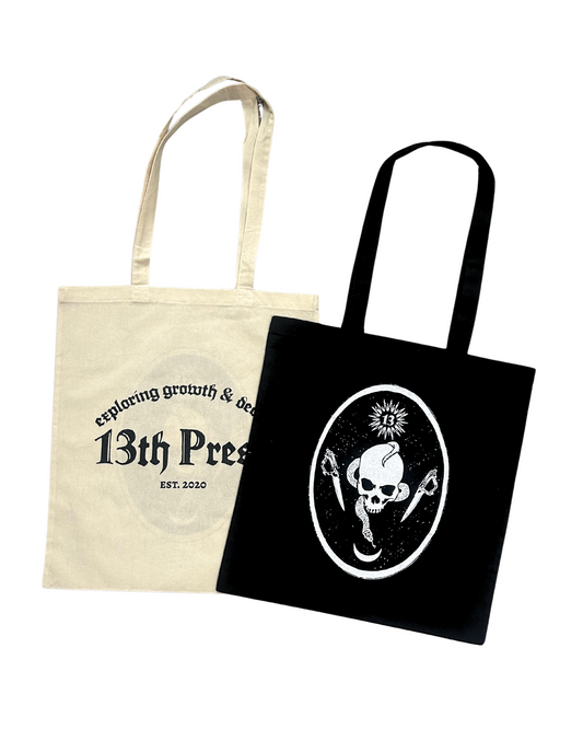 Two tote bags, one beige and one black, with different designs on a white background.