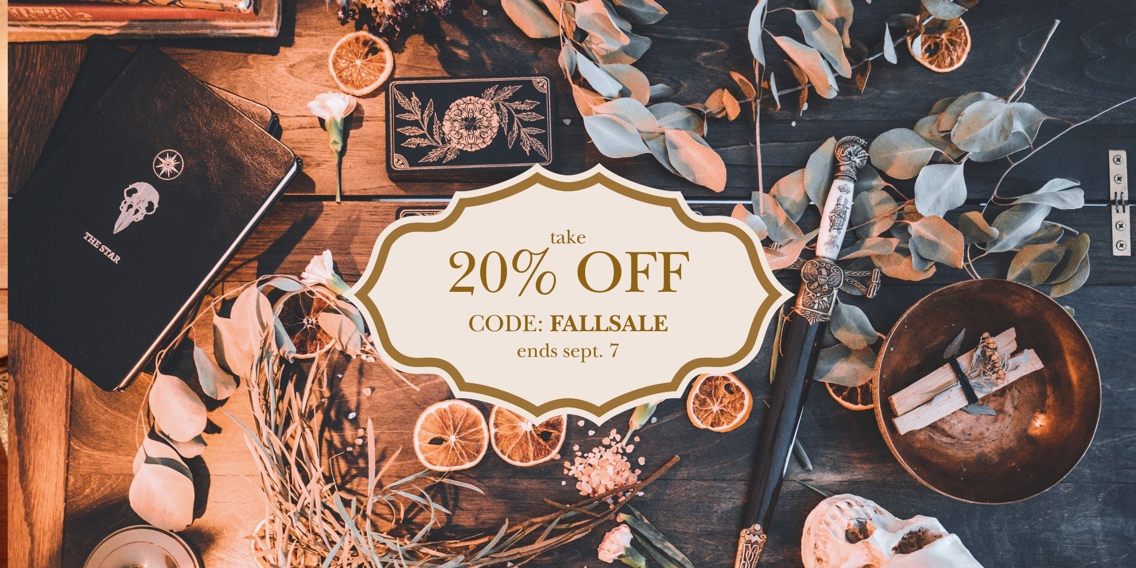 Promotional banner with 20% off code on a decorative background with flowers and stationery items.