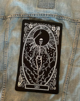 large embroidered back patch of leo zodiac sign from the mirror oracle deck by amrit brar and 13th press on blue denim jacket levis