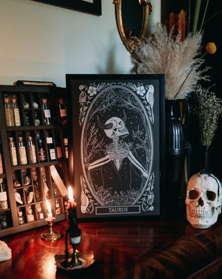 taurus zodiac sign art print on altar with candle light and tarot