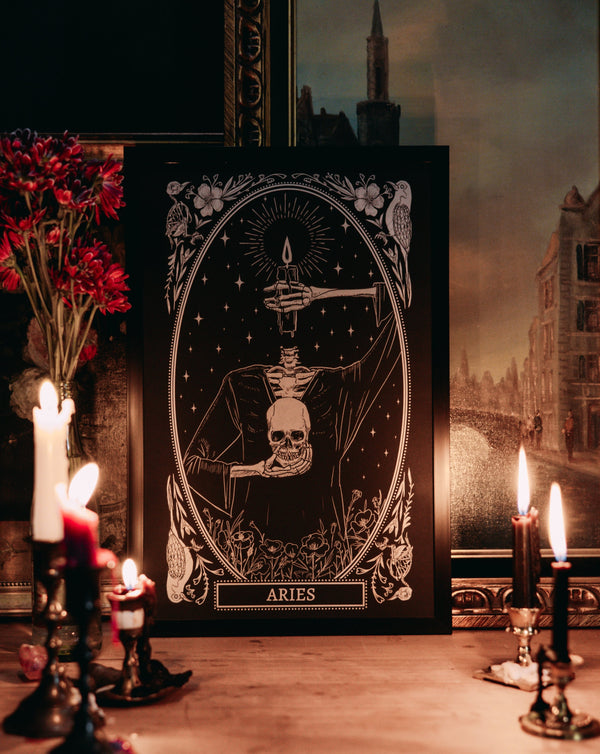 Aries zodiac print design from the Mirror Oracle deck on altar space with candle light