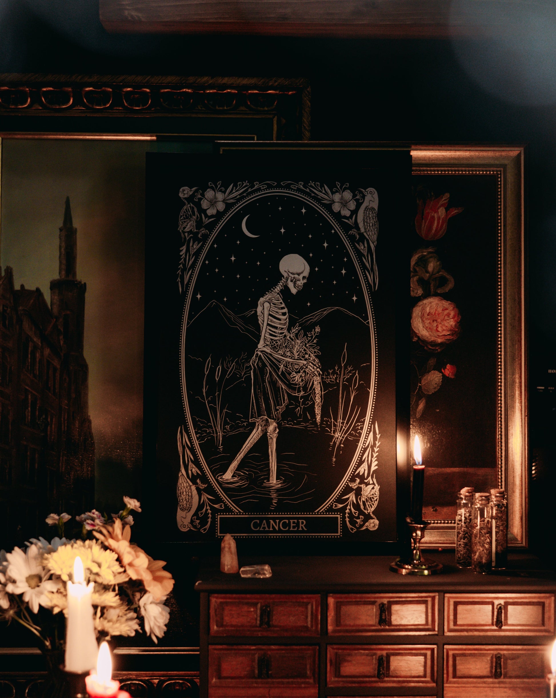 cancer zodiac print design from the mirror oracle deck on altar space with candle