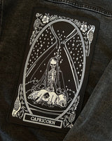 large embroidered back patch of capricorn zodiac sign from the mirror oracle deck by amrit brar and 13th press.