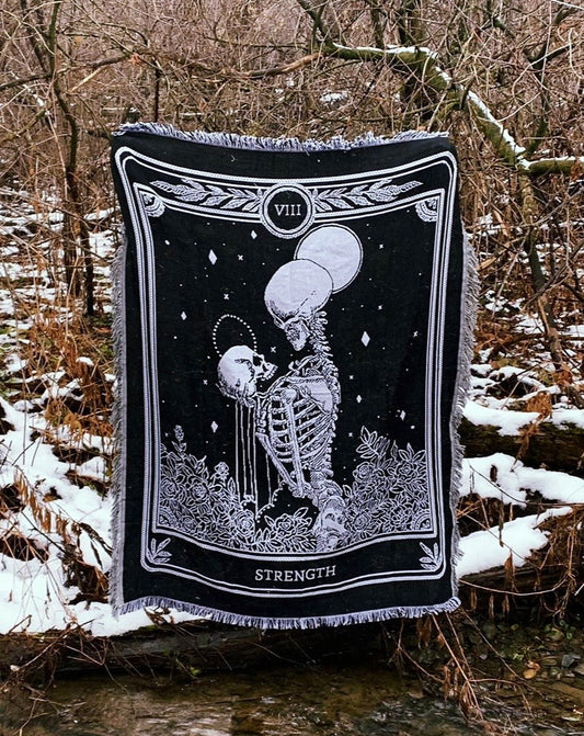 woven tapestry of the Strength tarot card from the Marigold Tarot deck by Amrit brar and 13th Press. 