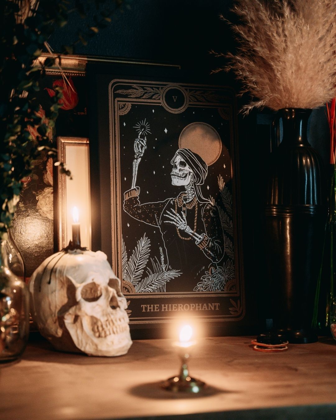 Hierophant print from the Marigold Tarot deck by Amrit Brar and 13th Press on altar stand with skull and candle. Black art print with gold and white ink.