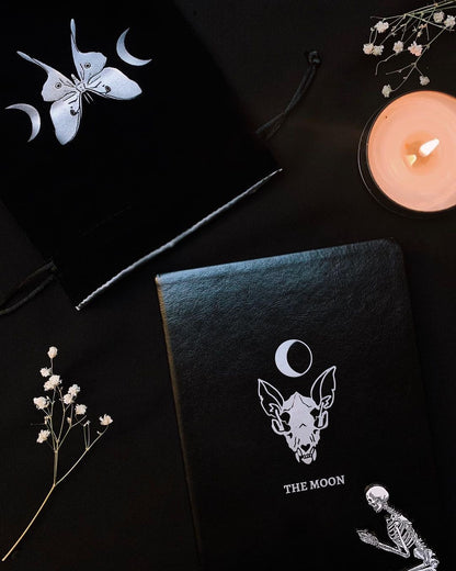 Lined journal with The Moon silver foil designed from the Marigold Tarot deck. Black ribbon