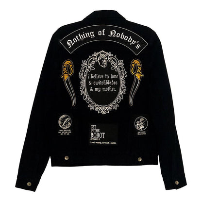 embroidered dagger gold and black thread iron-on patches designed by amrit brar and 13th press. Denim jacket embellished with iron-on patches