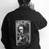 large embroidered back patch of death tarot card from the Marigold Tarot deck by Amrit Brar and 13th Press. Patch on black denim jacket.