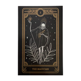 tarot art print in frame on wall of the Magician card from the Marigold Tarot deck by Amrit Brar and 13th Press on altar with candle light and tarot card reading
