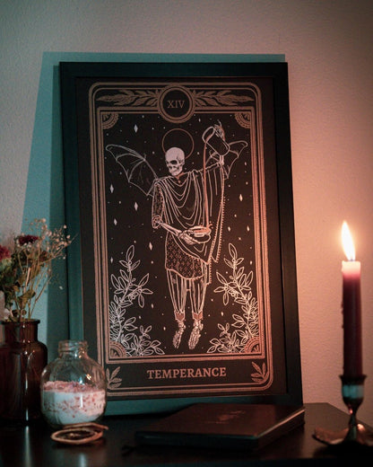 Tarot Temperance art print from the Marigold Tarot deck by Amrit Brar and 13th Press. Gold ink. Skeleton and candle. Features tarot journal