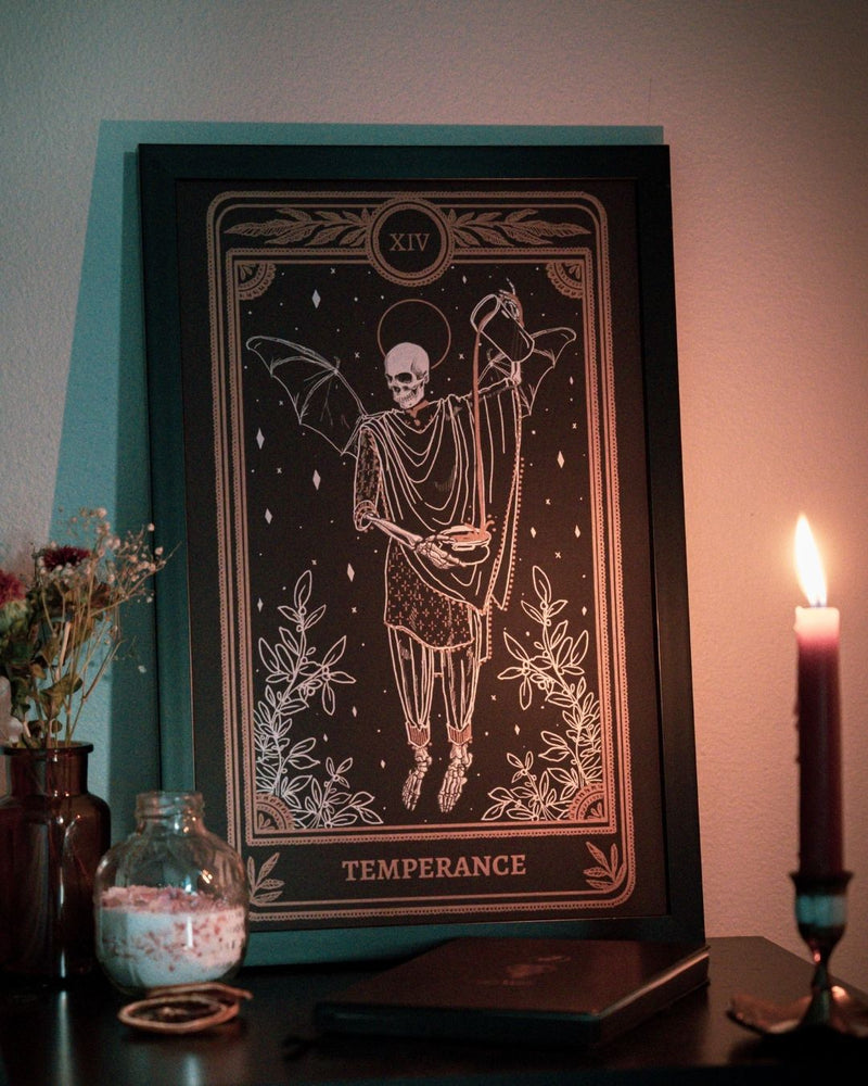 Tarot Temperance art print from the Marigold Tarot deck by Amrit Brar and 13th Press. Gold ink. Skeleton and candle. Features tarot journal