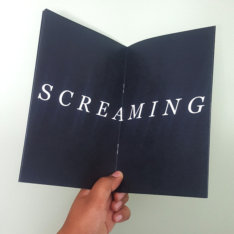 black paper zine short story titled guide to baby's first existential crisis. Black and white zine short story