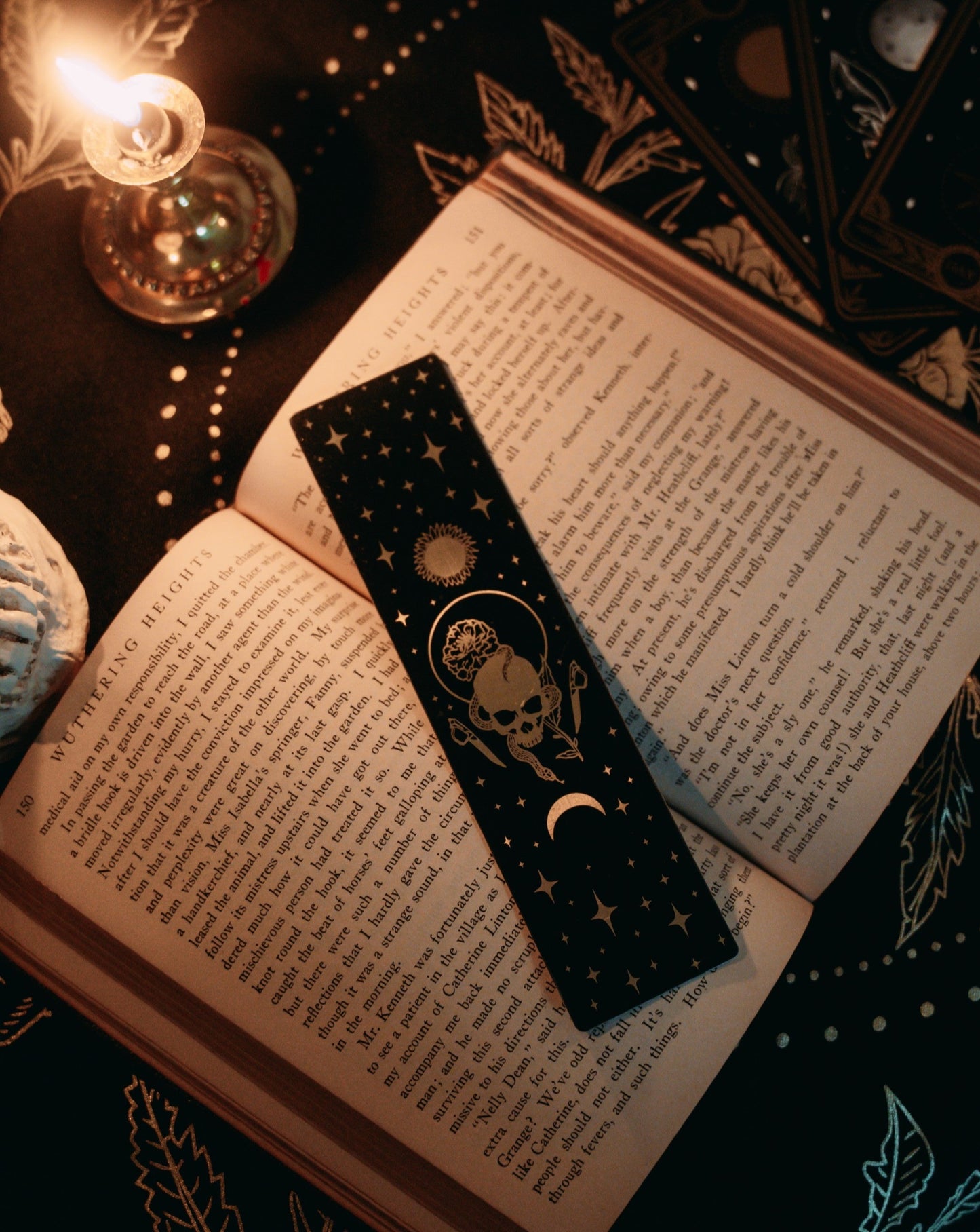 bookmark with Marigold Night tarot card design. Art from the Marigold tarot deck by Amrit Brar and 13th Press. Black and gold metal bookmark.