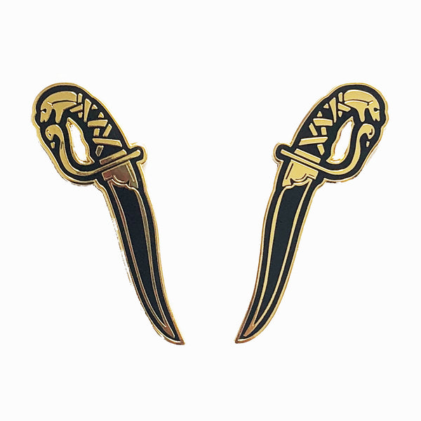gold and black hard enamel pin set of kirpans, twin blades with serpent heads designed by Amrit Brar and 13th Press