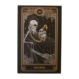 Tarot Devil print from the Marigold Tarot deck by Amrit Brar and 13th Press. Skeleton and serpant. Gold ink