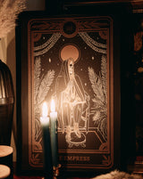 tarot wall art of the Empress card from the Marigold Tarot deck by Amrit Brar and 13th Press on altar with candle light and tarot card reading