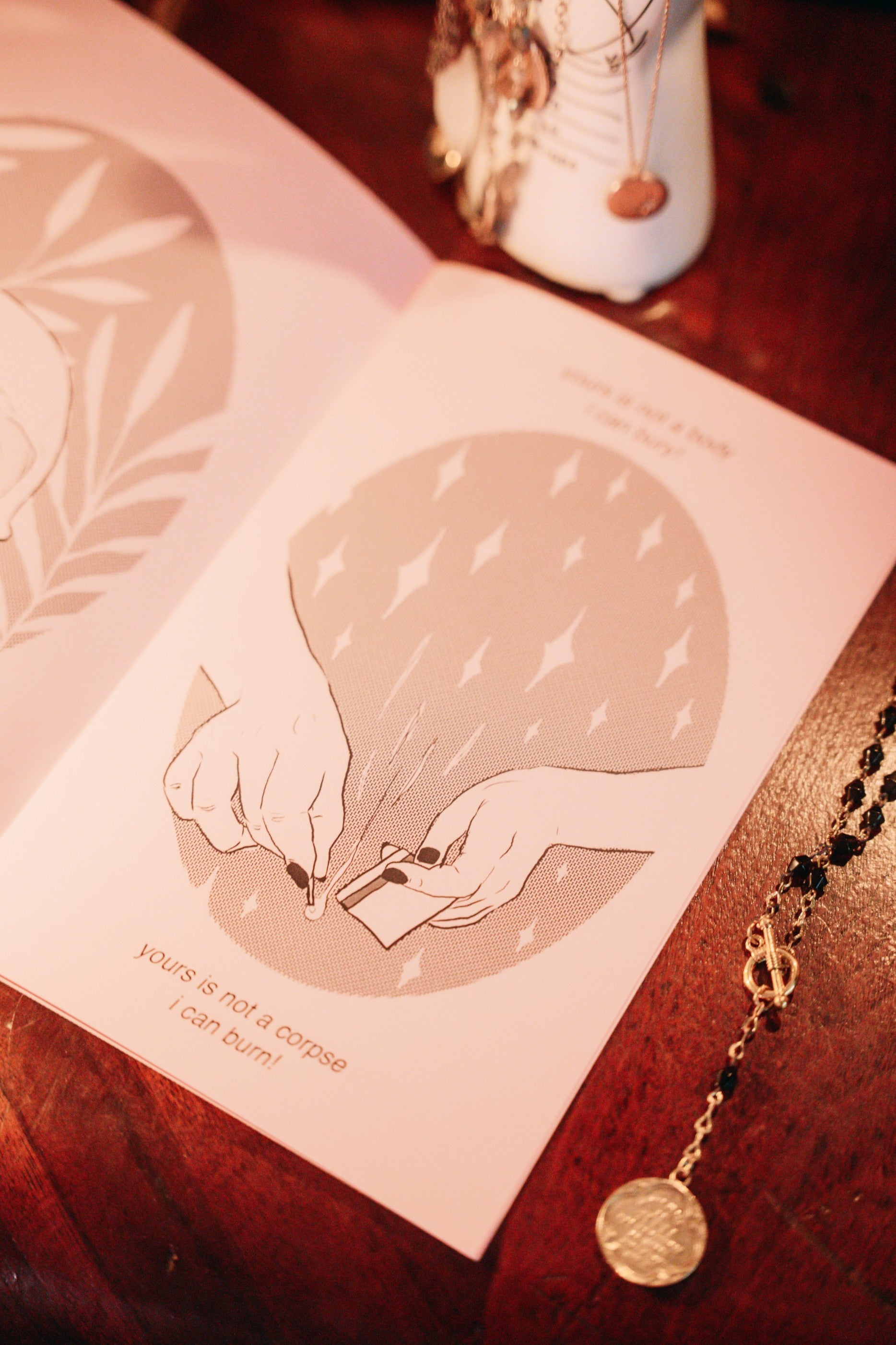 Page from the "for sister" zine. Zine titled "for sister" with green cover and pink pages. Written and illustrated by Amrit Brar and published by 13th Press. Page reads "yours is not a corpse I can burn!"