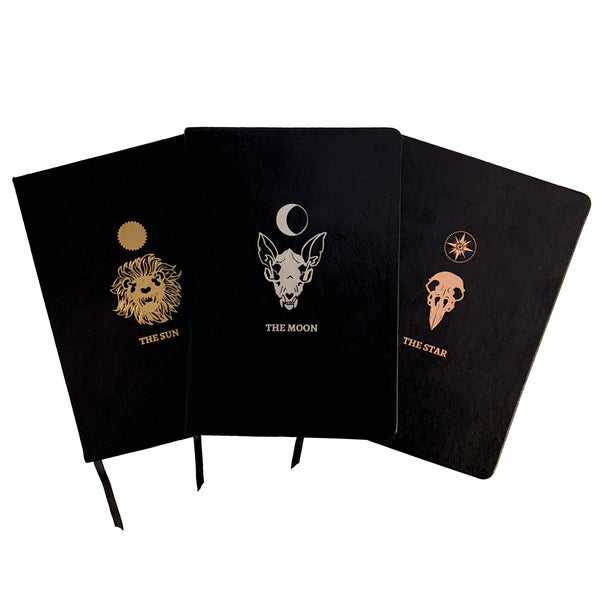 lined journal, bullet journal, and blank journal, set of three journals with the Moon, the Star, the Sun art from the Marigold Tarot deck by Amrit Brar and 13th Press. Foil printed, faux leather journals