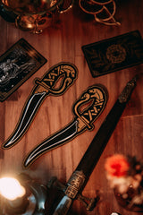 embroidered dagger gold and black thread iron-on patches designed by amrit brar and 13th press