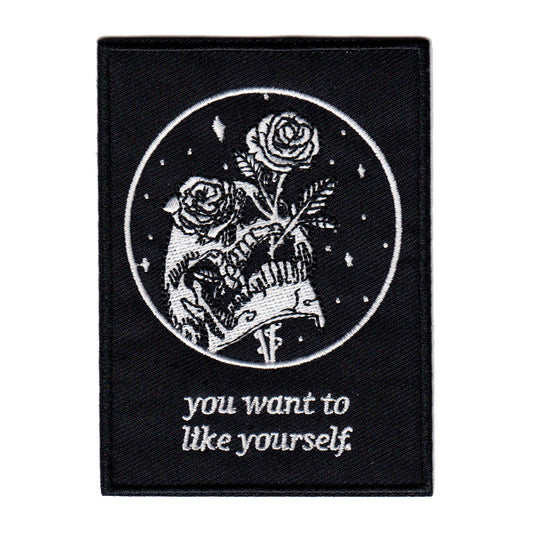 black and white embroidered iron-on patch with skull and rose design by Amrit Brar and 13th Press