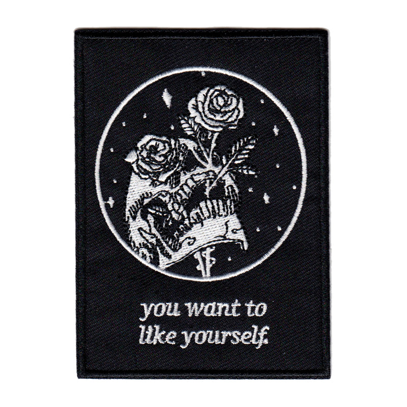black and white embroidered iron-on patch with skull and rose design by Amrit Brar and 13th Press