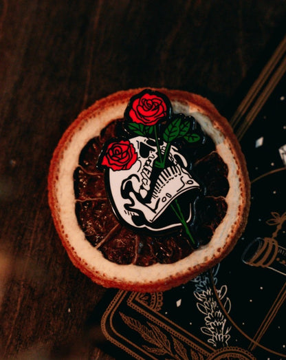 metal hard enamel pin of skull head and red roses designed by Amrit Brar and 13th Press
