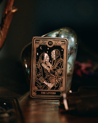the lovers black, gold, and white metal hard enamel pin design from the Marigold Tarot deck by Amrit Brar and 13th Press