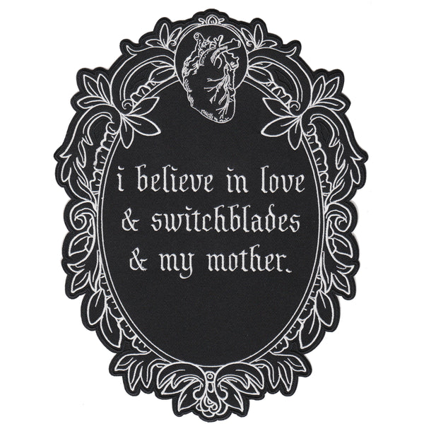 black and white iron-on embroidered back patch design from the Marigold Tarot deck by Amrit Brar and 13th Press. Text reads "i believe in love, switchblades, and my mother"