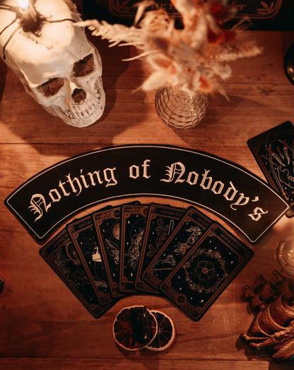 black and white embroidered large iron-on patch that reads "nothing of nobody's" in gothic font. 