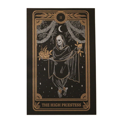 tarot card art print of the High Priestess tarot card from the Marigold Tarot deck by Amrit Brar and 13th Press. Black paper with white and bronze gold ink. Skeleton woman holding pomegranate and flowers.