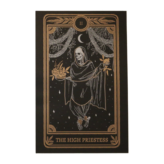 tarot card art print of the High Priestess tarot card from the Marigold Tarot deck by Amrit Brar and 13th Press. Black paper with white and bronze gold ink. Skeleton woman holding pomegranate and flowers.