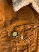 hard enamel pin of death-head moth designed by Amrit Brar on sherpa jacket