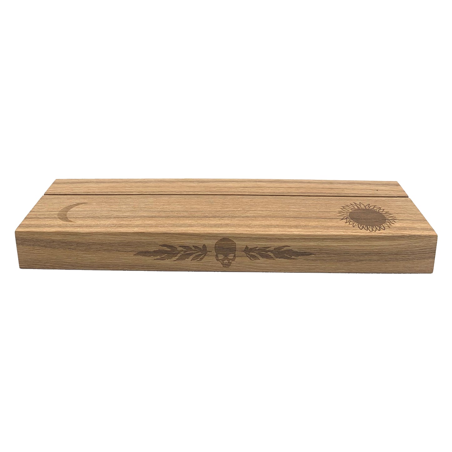 Ash wood stand featuring a hot-stamp of a skull and marigold leaves, waning crescent moon, and the sun. Excellent for holding and displaying readings while working, or for decorating your altar or desk. Comfortably fits three standard size 2.75” x 4.75” tarot or oracle cards. Stand colour may vary slightly due to differences in wood colouration. Dimensions: Approx 11.75" L x 3.5" W x 1.25" H / 30cm L x 9cm W x 3.18cm H. Composition: Ash wood. Tarot, altar, altar stand, tarot card stand, altar decor
