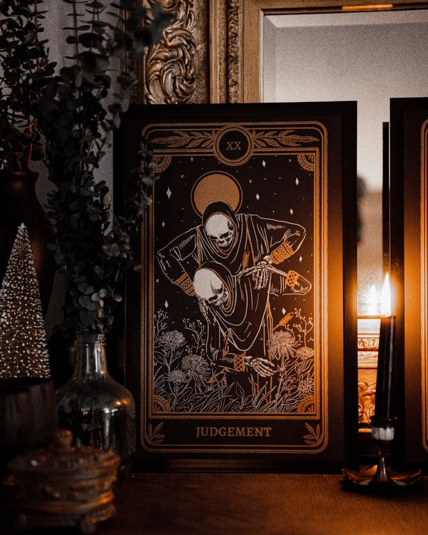 tarot art print of judgement card from Marigold Tarot deck by Amrit Brar and 13th Press. Candle and eucalyptus in background.