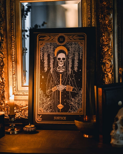 tarot art print with Justice card design from the Marigold Tarot deck by Amrit Brar and 13th Press. Black and gold ink.