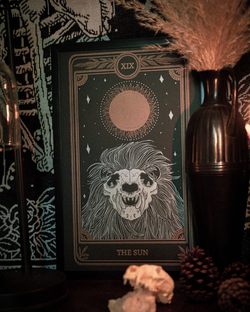 Tarot sun print with a black and gold ink and sun.