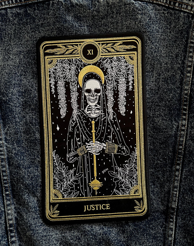 large embroidered iron-on back patch with justice tarot card design from the marigold tarot deck